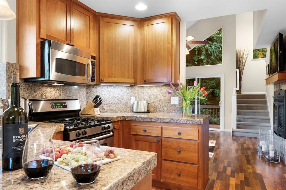 Warm wood tones wrap around you in this convenient kitchen