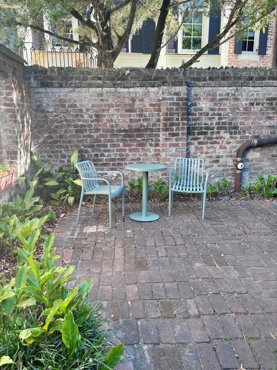 This rear courtyard is a shared space that all 3 apartments may use and walk through to access back gate