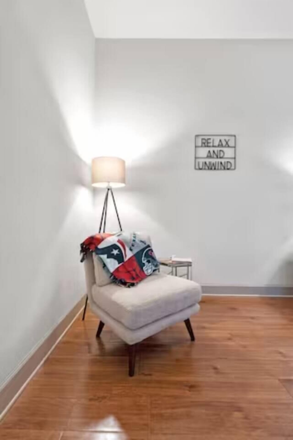 Settle into the modern wood and faux‑fur chair for a cozy reading nook or extra seating.