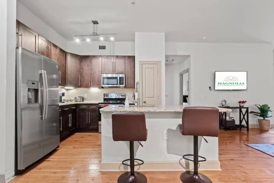 Cook confidently in the open kitchen with plenty of counter space for prepping meals.
