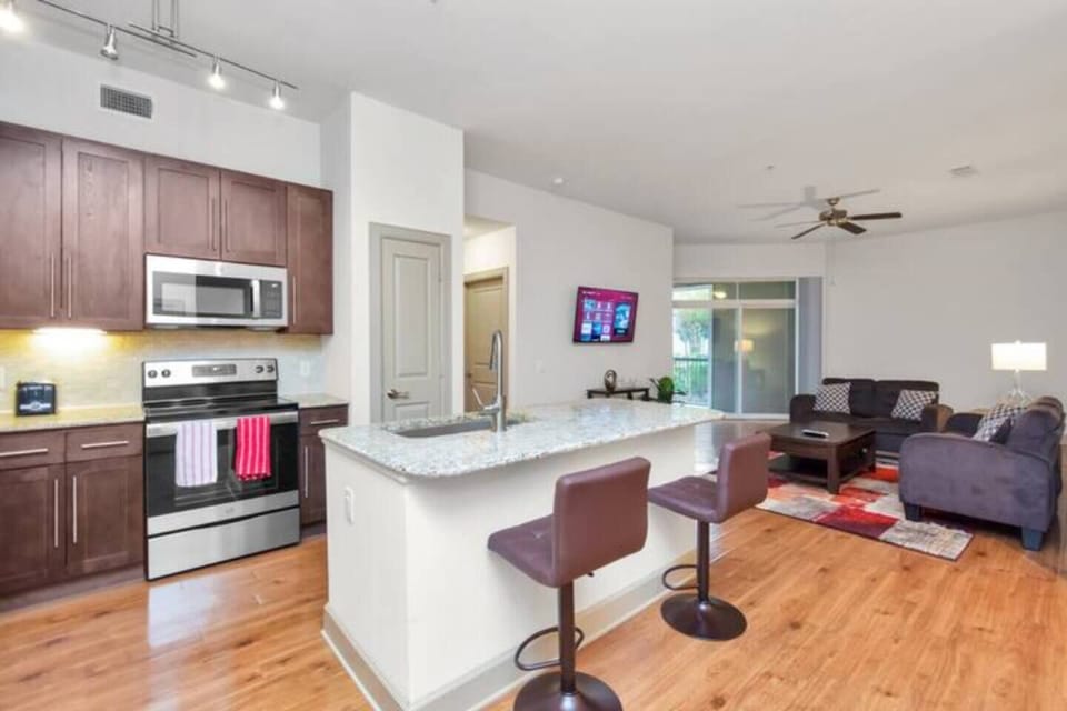 Cook your favorite meals in the open‑concept kitchen with island seating so you can eat in and feel at home.