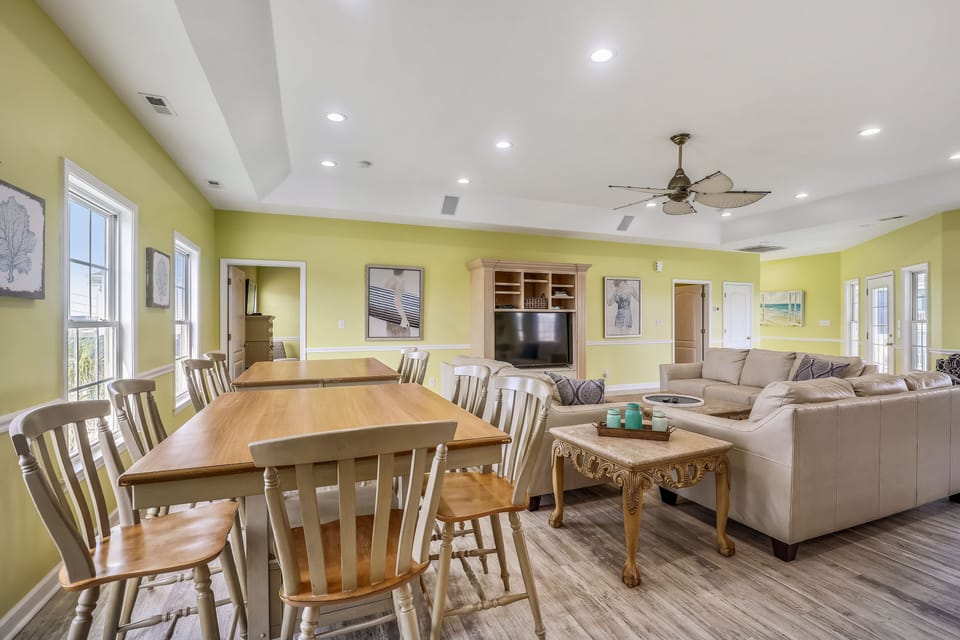 This bright and sunny room allows everyone to enjoy a meal together.