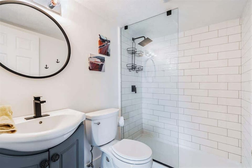 The Lower Level Guest Queen Suite Also Features a Sleek En Suite Restroom