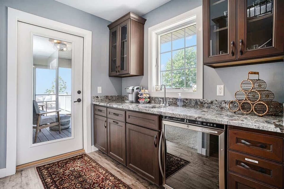 An Added Touch for Comfort - The Second Level Hallway Comes with a Kitchenette Complete with a Keurig and Access to the Screened-in Patio Room