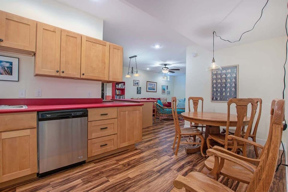 Enjoy the  Basement Living Area with Game Table & Kitchen Area