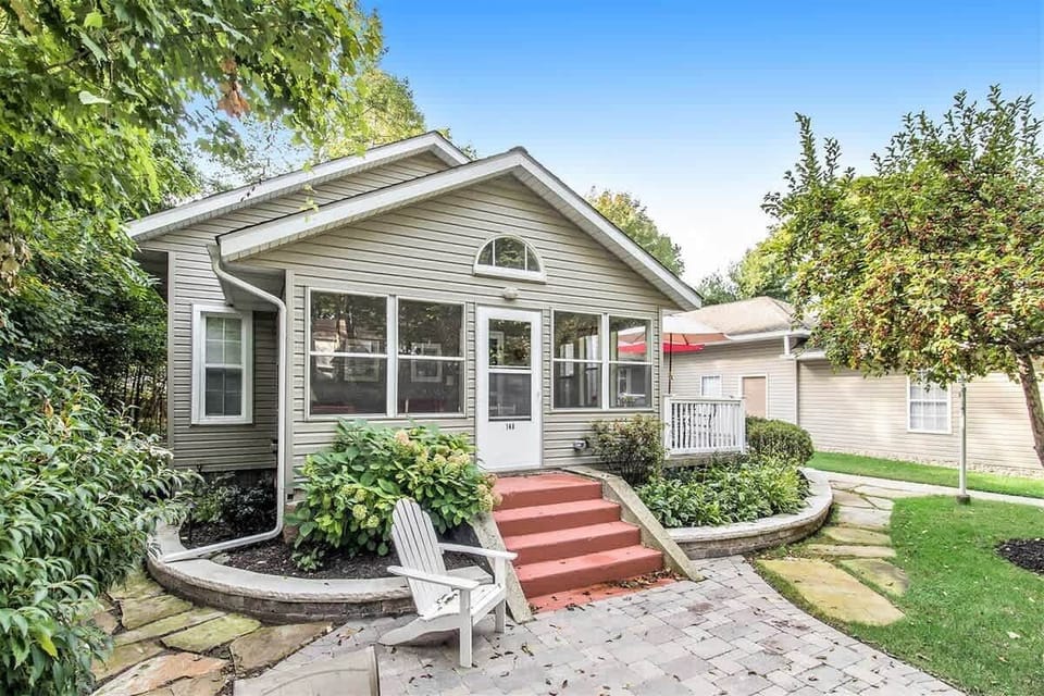 Enjoy the Summer Breeze from the Comfort of the Three Seasons Porch