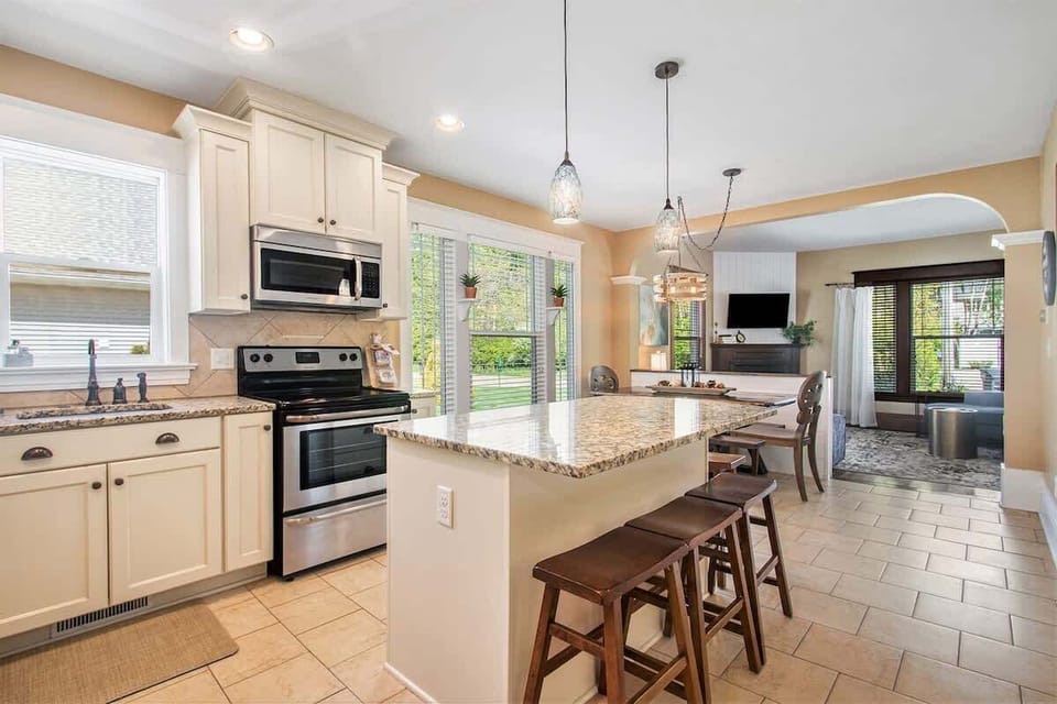 Discover Culinary Ease with the Kitchen`s Spacious Countertops and Island
