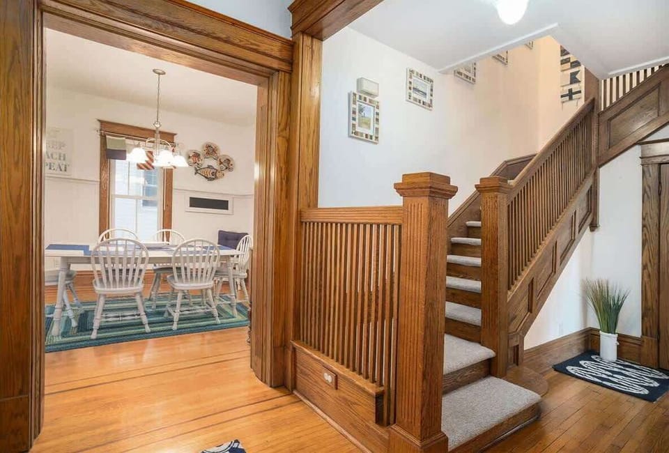 Ascending the Beautifully-crafted Wooden Staircases at A Harbor View to Venture Over to the Cozy Sleeping Spaces