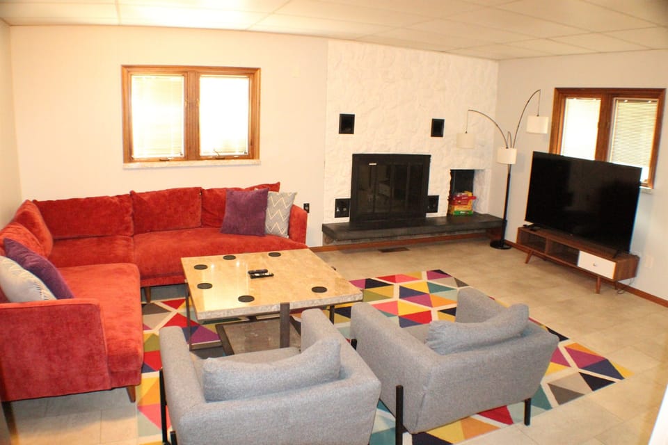 Living room with adjacent kitchen and dining