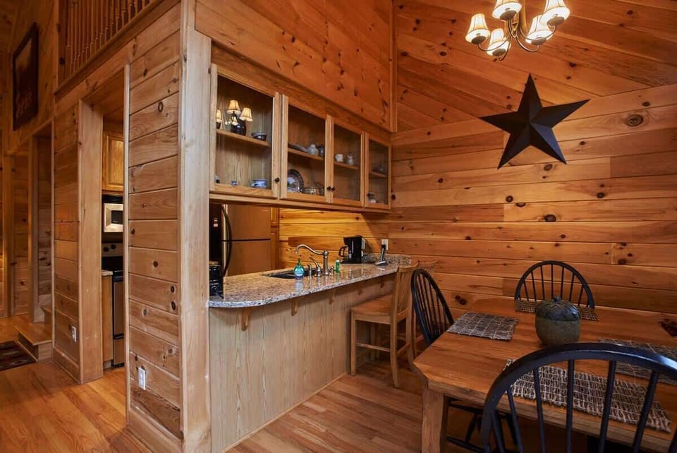 Kitchen with a view of the dining table and deck