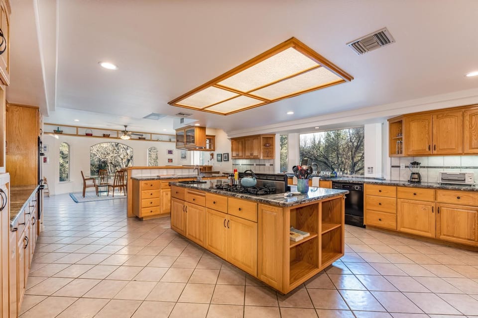 Large kitchen with island and two refrigerators
