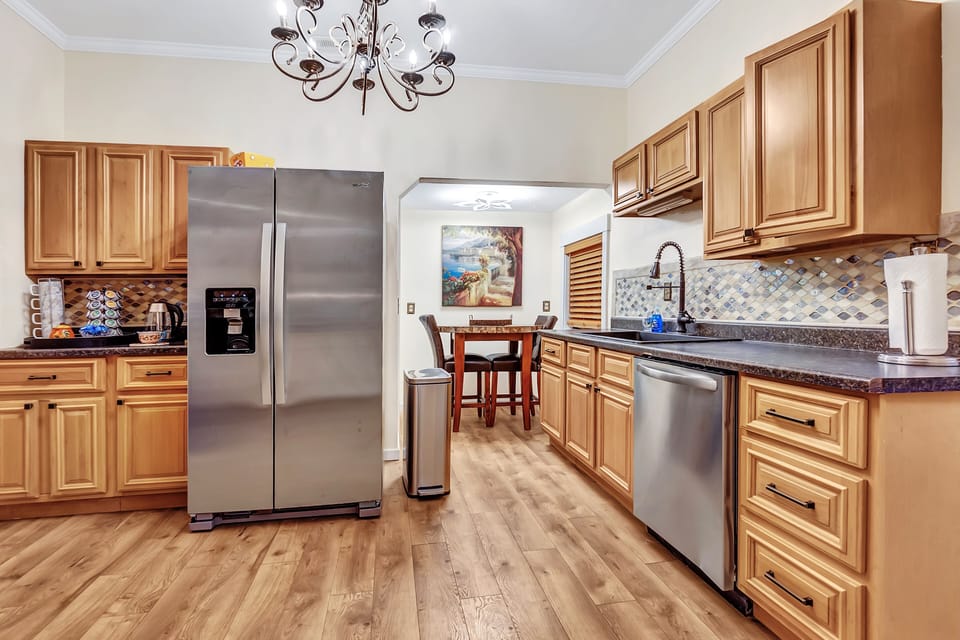 The kitchen is smartly stocked w/ all basic necessities & supplies