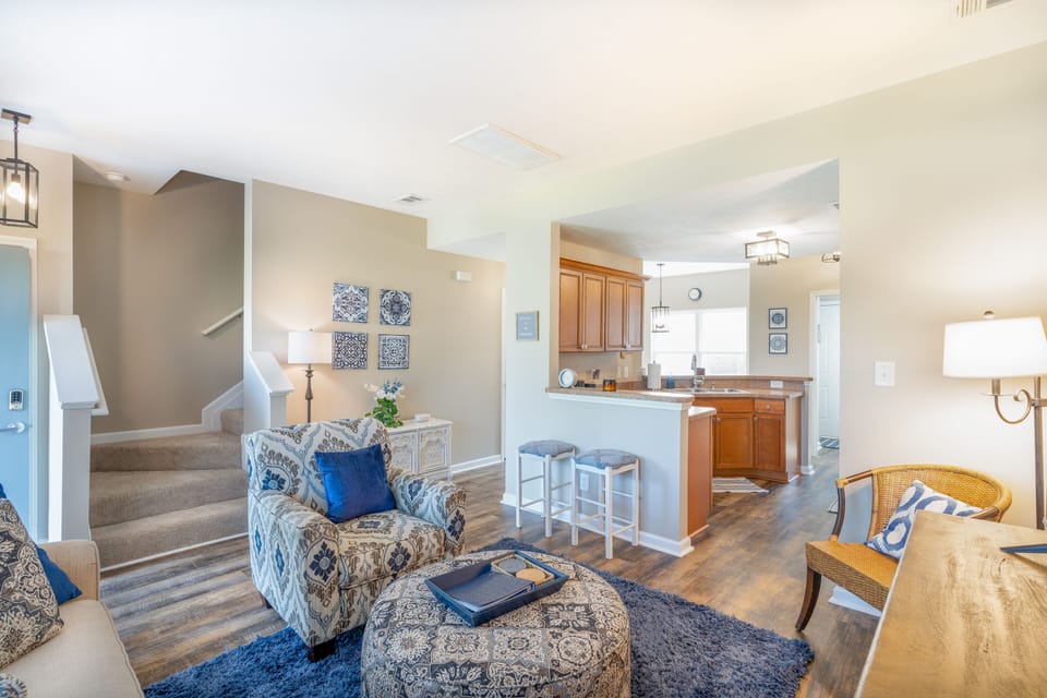 Living room,  kitchen. Half bath, dining and laundry room on first floor. 
