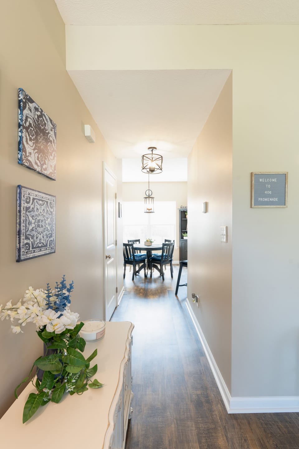 View from Front door with half bath, dining room and kitchen to the right 