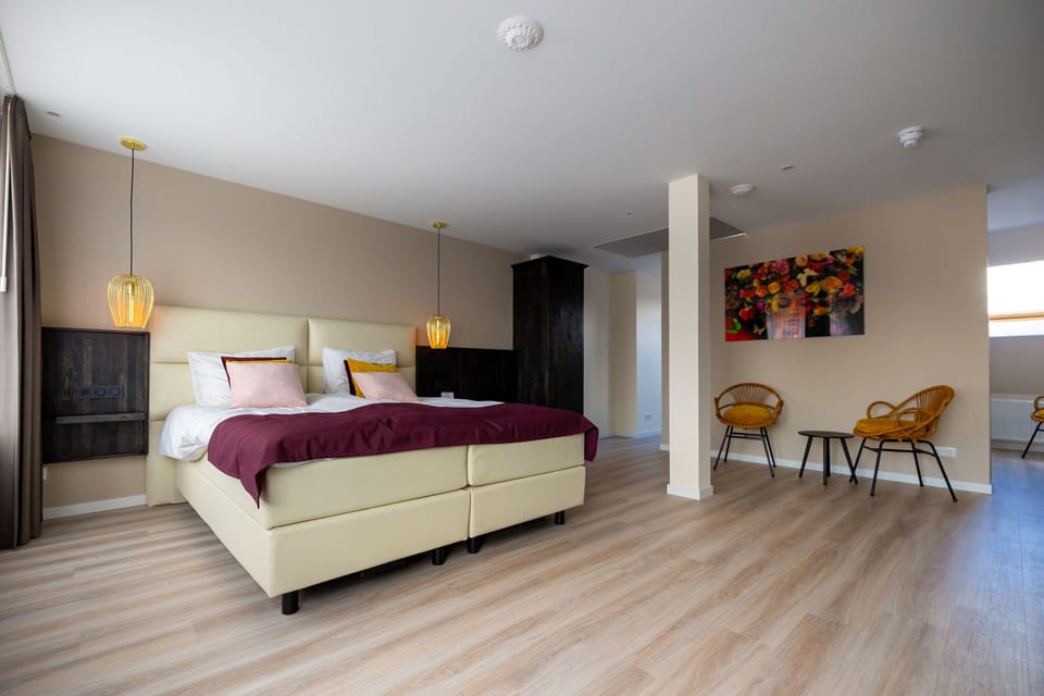 Deluxe Quadruple Room | Memory foam beds, in-room safe, blackout drapes, iron/ironing board