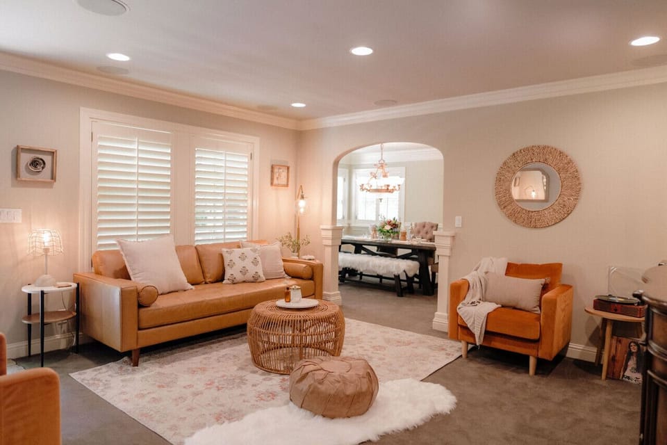 `Unwind in Our Newly Designed Living Room, Offering Extra Seating.`