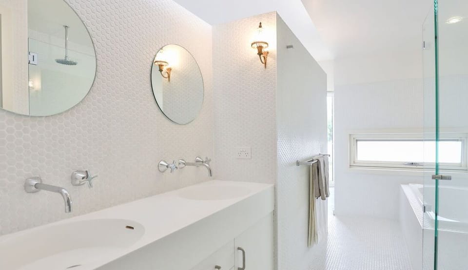 Ensuite bathroom with walk in shower and separate bath tub.