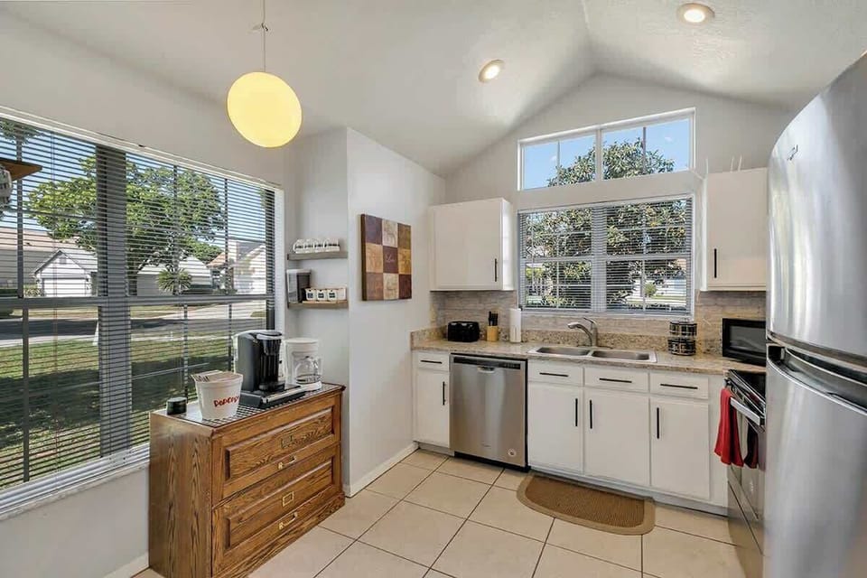 Spacious and inviting kitchen complete with Coffee Bar (k-cups, Keurig, coffee, coffee maker, creamer, sugar, sugar substitute, honey), pots & pans, silverware and everything you should need to make this your home away from home!