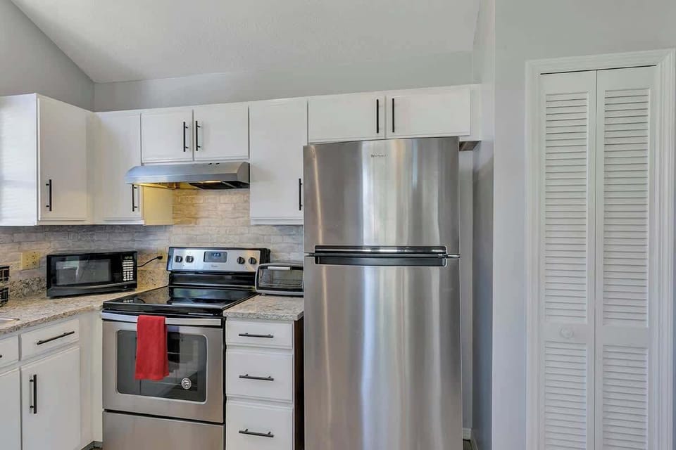 Spacious and inviting kitchen complete with Coffee Bar (k-cups, Keurig, coffee, coffee maker, creamer, sugar, sugar substitute, honey), pots & pans, silverware and everything you should need to make this your home away from home!