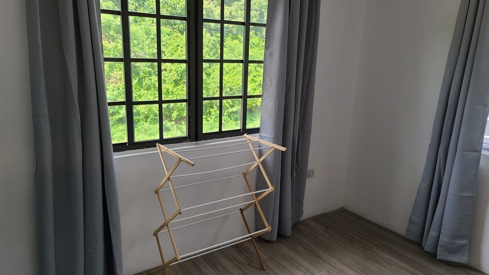 Foldable clothes hanger to help dry clothes if raining.