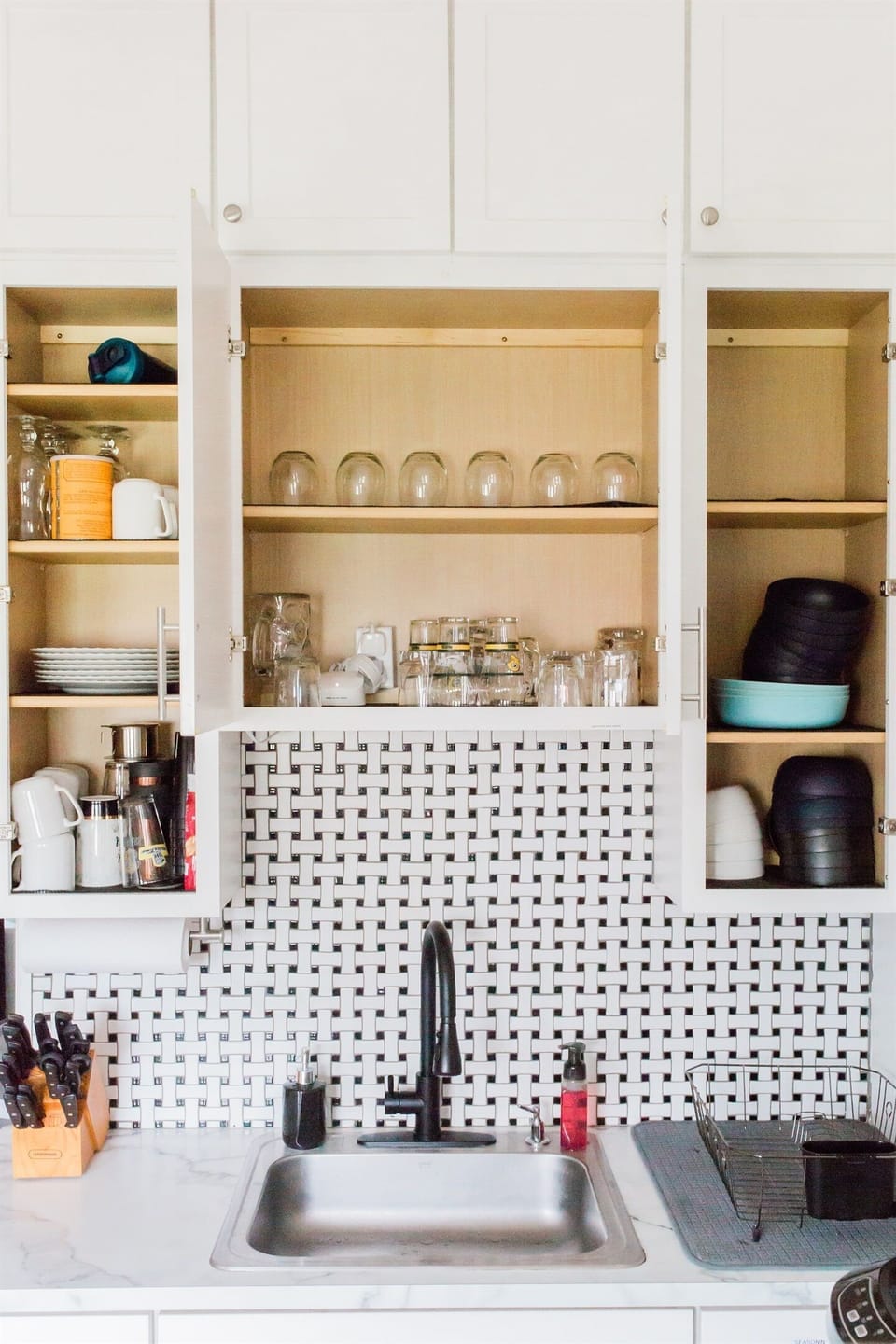 Fully Equipped Kitchen (Main Level): Large refrigerator with freezer, complete with mugs and glasses.