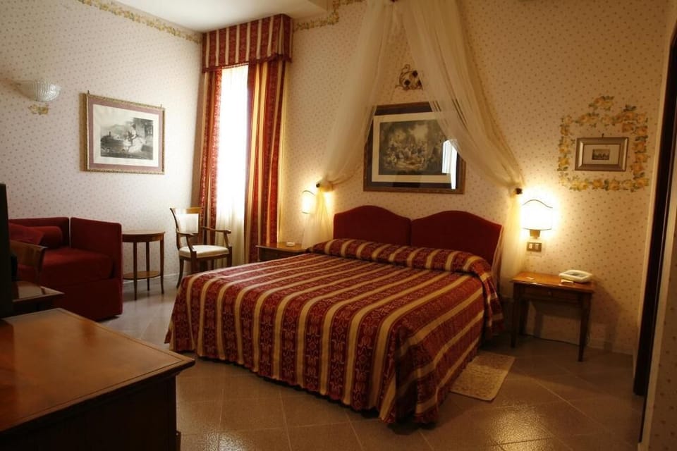 Standard Triple Room | Minibar, in-room safe, iron/ironing board, free WiFi