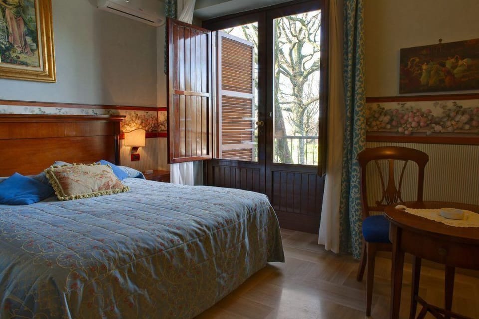 Standard Double or Twin Room | Minibar, in-room safe, iron/ironing board, free WiFi