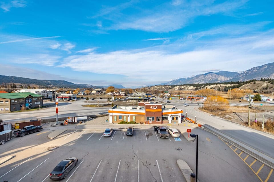 Private, top-floor balcony with outdoor seating, a BBQ (propane included) and Rocky Mountain views.