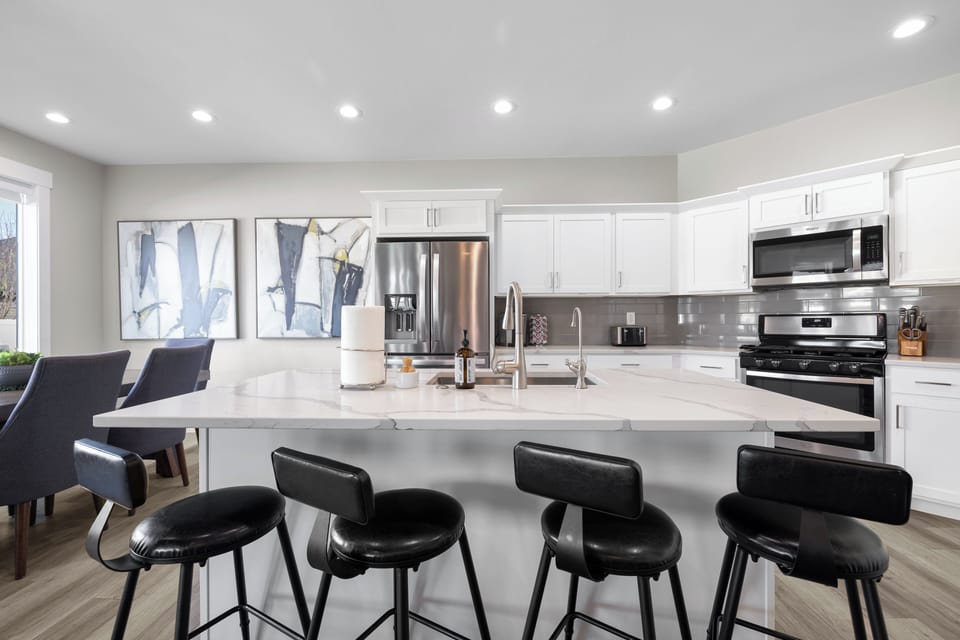 The large kitchen island seats four. There's a good-sized pantry as well.
