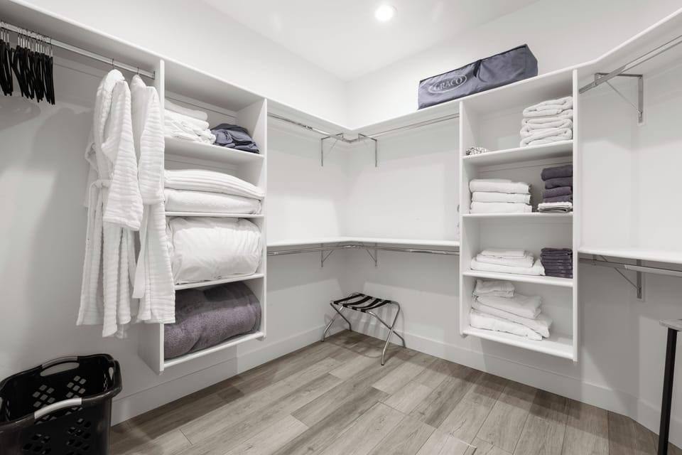 In the master closet, you'll find plenty of extra linens - plus a pack-and-play.