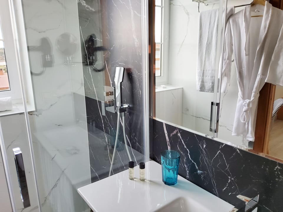 Standard Double Room | Bathroom | Shower, hair dryer, towels, soap