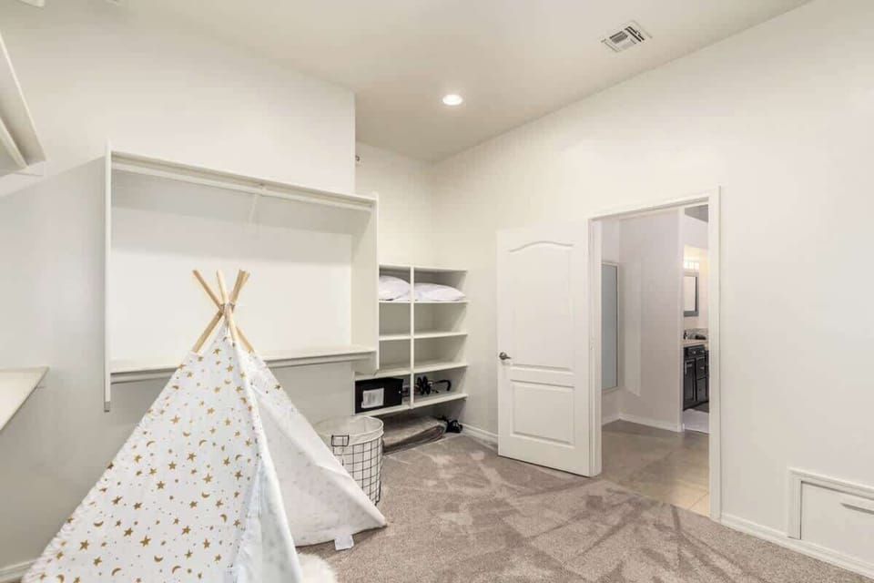Huge walk-in closet with private play area for the little ones