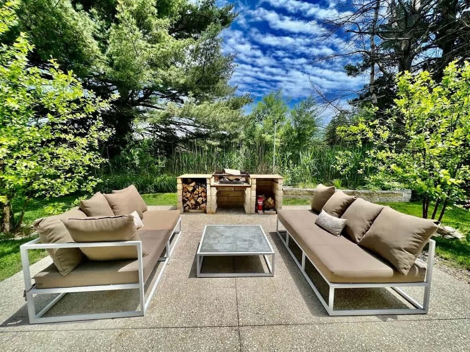 Outdoor living at The White Owl is elevated by fireside seating area.
