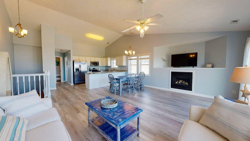 View of kitchen and dining from living area