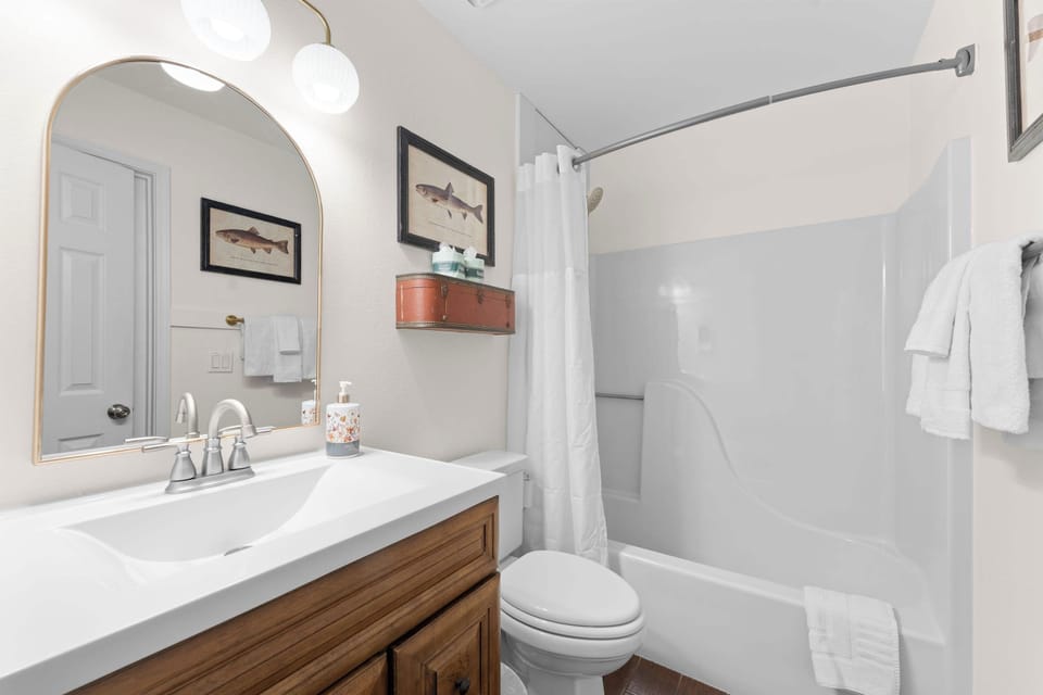 Full bath off of king bedroom and also accessible by living room