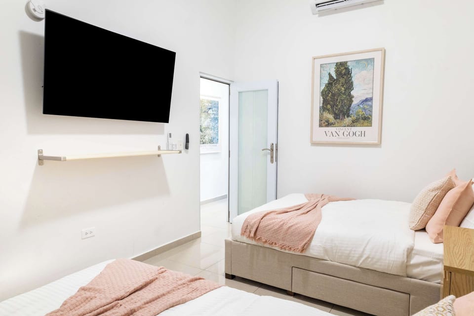 Bedroom 2 with 2 Queen Beds & TV
