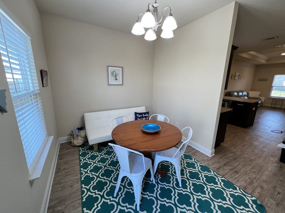 Dining room along features a futon for convertible guest space 