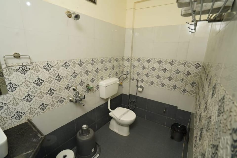 Shower, designer toiletries, hair dryer, towels