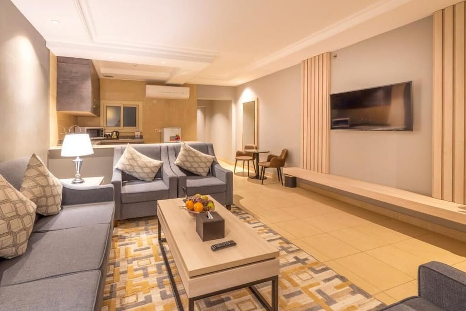 Family Suite, Multiple Beds | Living area | 32-inch LED TV with satellite channels, computer monitors, printers