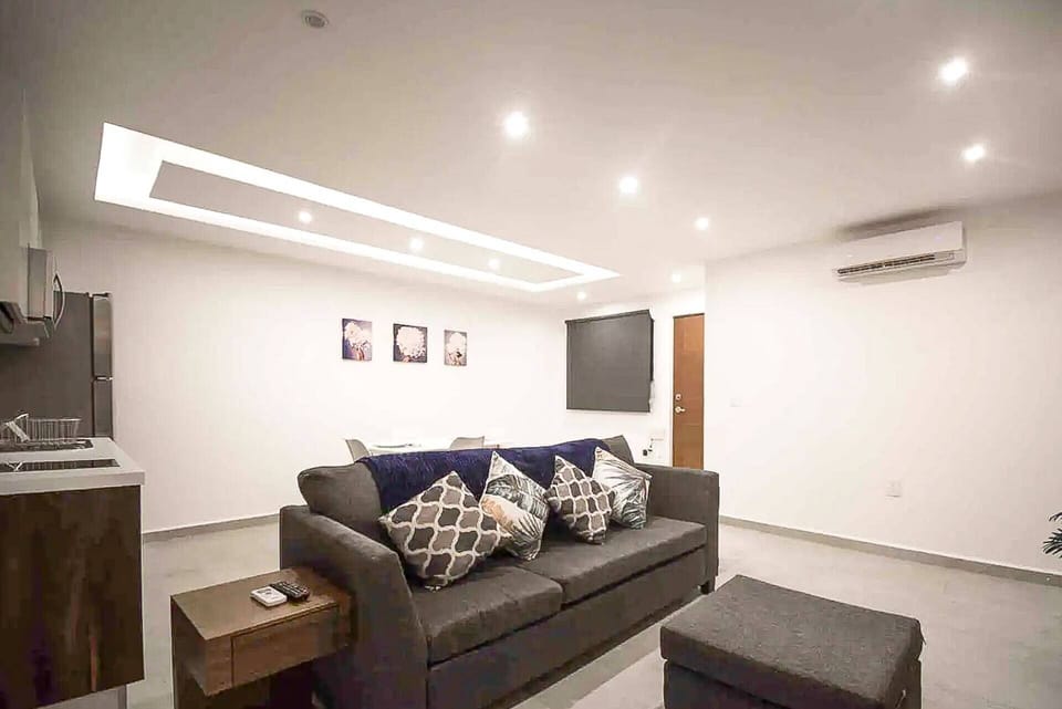 Spacious living room with a couch and TV