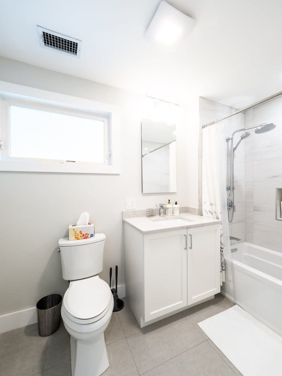Tub/Shower combo bathroom with handheld and rain shower head