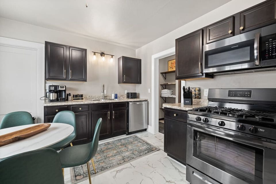 Fully stocked kitchen with modern appliances, cookware, and essentials, ready for all your culinary needs.
