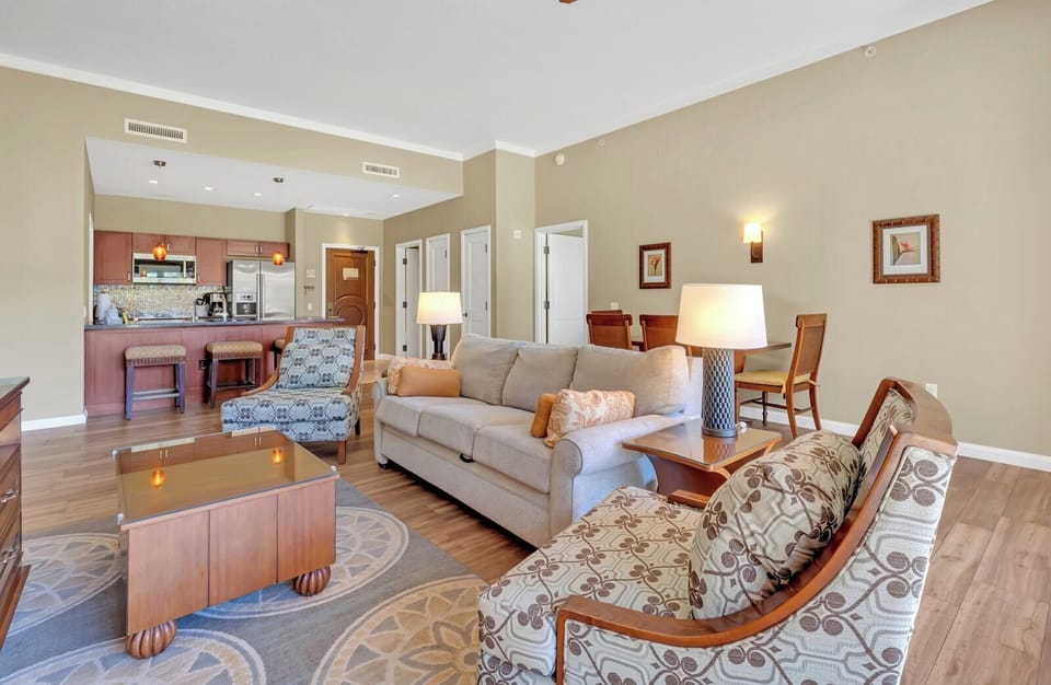 Elegant open-concept suite with cozy seating and modern kitchen design.