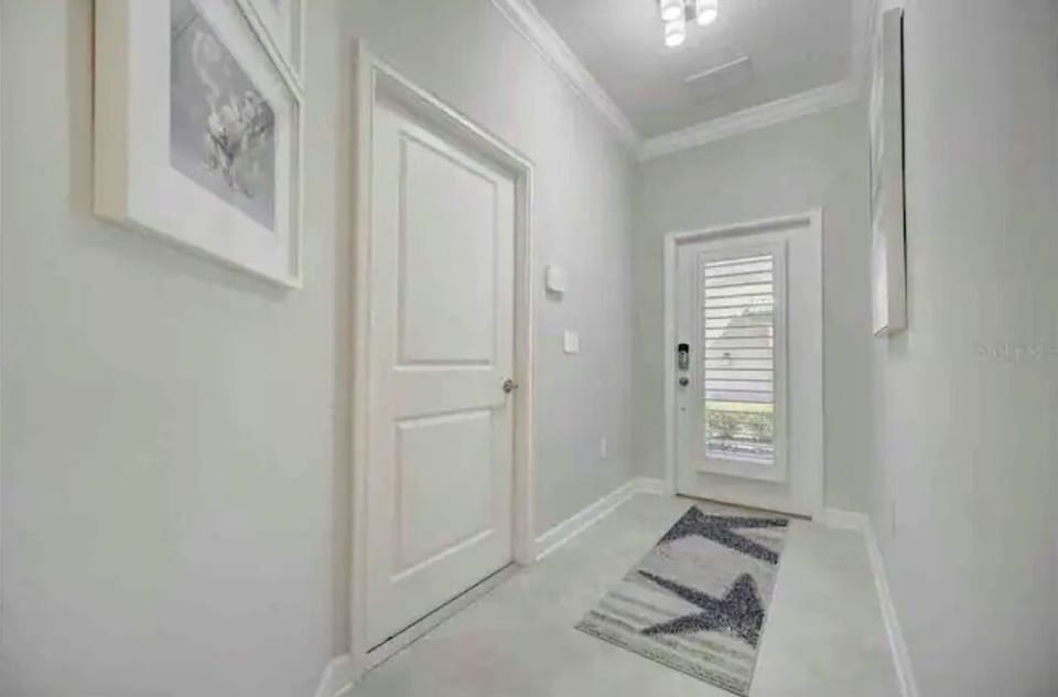 Main entrance hall and entrance door from attached garage also