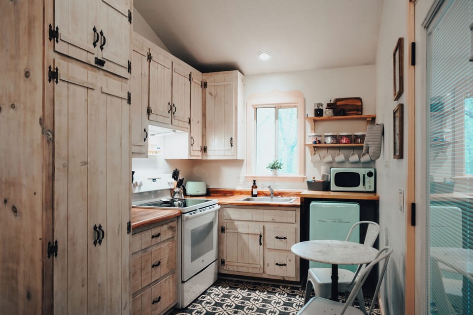 Fully stocked kitchen- microwave, stove, toaster, pour over coffee maker, mini f