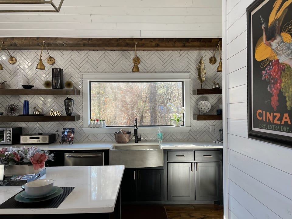 Concrete farm sink, plenty of counter space and abundant lighting - just to name a few of the special touches in the kitchen (and beyond!)