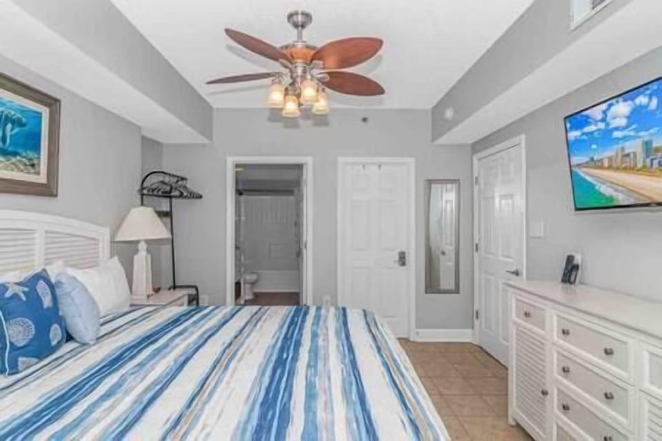 Spacious master bedroom w/ en-suite bathroom and flat screen tv.