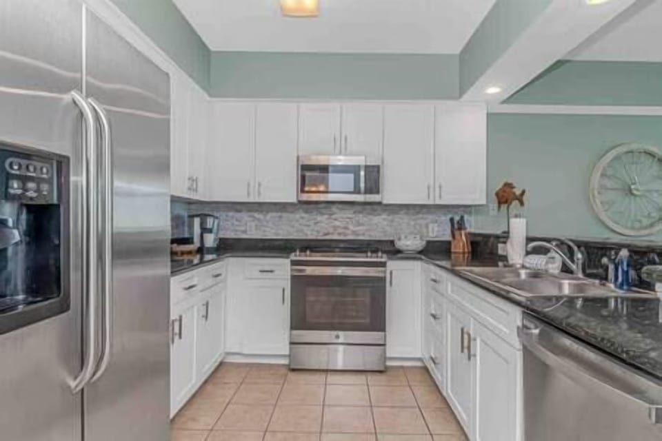 Updated kitchen with stainless steel appliances and plenty of counter space.