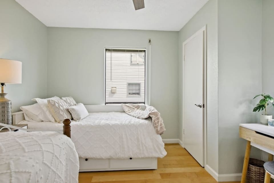 Another view of the secondary bedroom with plenty of space for all your guests! It has enough rooms and beds to allow everyone to have a good night's sleep and wake up feeling recharged and relaxed.