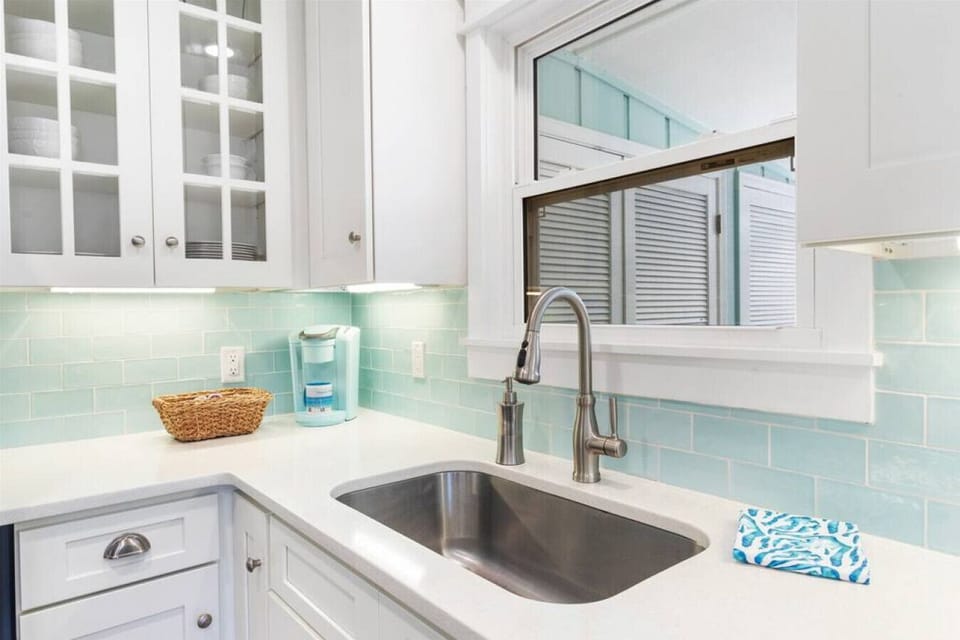 Blue Sky Cottage- Kitchen window overlooks the backyard and pool